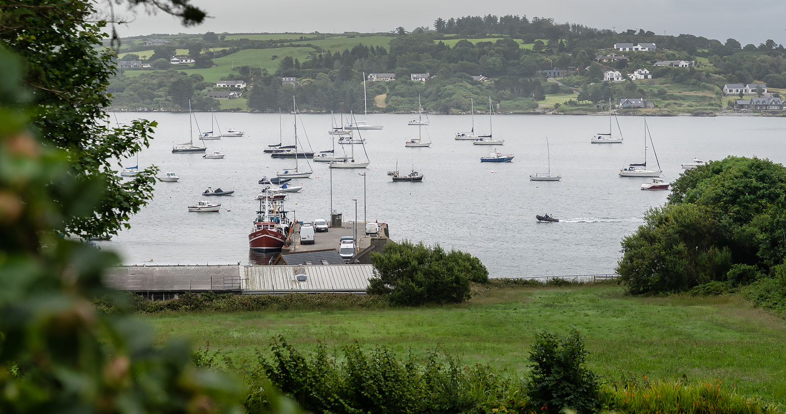 A view from outside over a lake with boats.