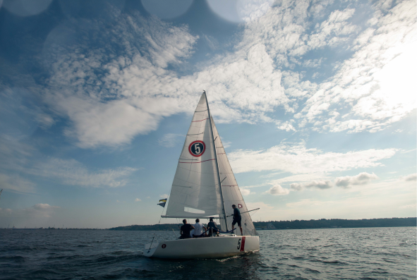 A sailing yacht on a lake.
