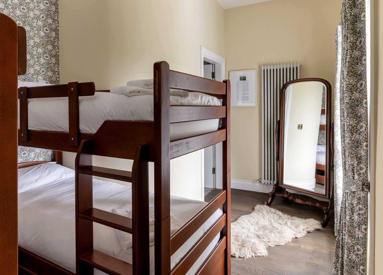 A yellow bedroom with a bunk bed.