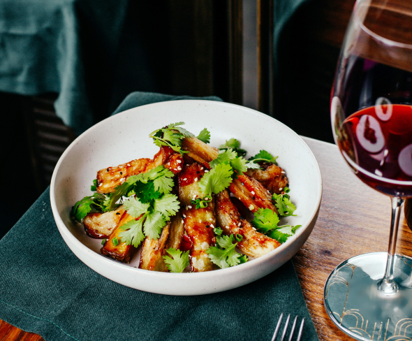 Close up of food and wine on a table.